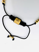 Pulseira dourada com bola Punto fino
