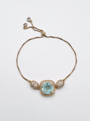 Pulseira dourada com pedra verde água SJ
