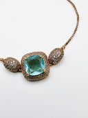 Pulseira dourada com pedra verde água SJ